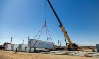 Crane lifting packaged cargo